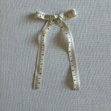 Cream ruler Bow